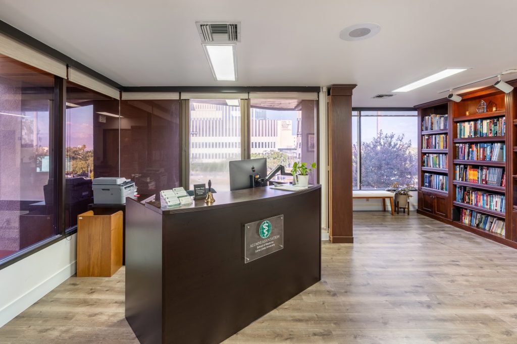 The reception area’s renovation offers a bright and welcoming space upon arrival with new flooring and paint throughout.