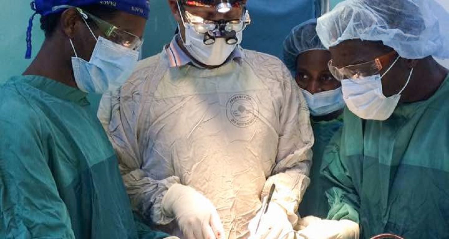 Hayton-3 Dr. Hayton performs a trauma neurosurgery with PAACS residents, Drs. Lijalem and Kokulol, at Malamulo Adventist Hospital.