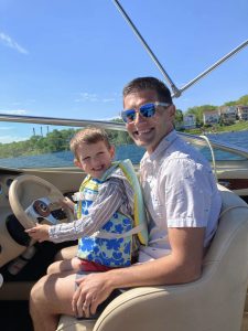 Steven Heller and son on a boat
