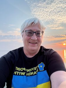 Photo of Dr. Nancy S. Lind with the sun in the background