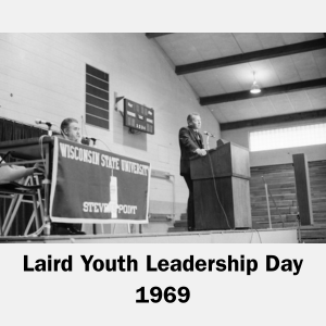 Man at podium speaking at Laird Youth Leadership Day in 1969