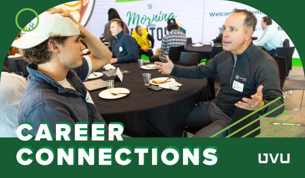 Career Connections. Two people chat at a table.