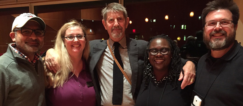 Cameo Carlson ’93 poses with Peter Coyote '64 and other Alumni Council Members.