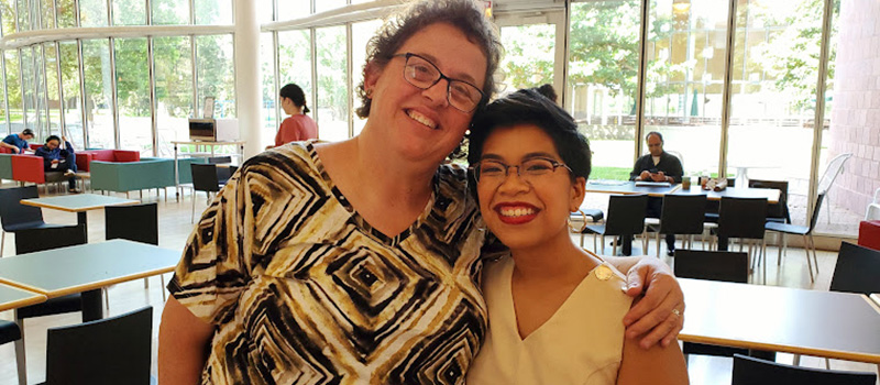 Joy Sales ’13 poses with Prof. Sarah Purcell.