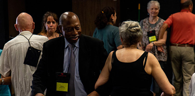 Henry Wingate ’69 and a dance partner dance together during a folk dance session.
