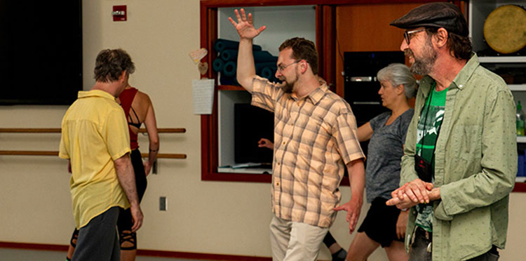 A group of Alumni dance.