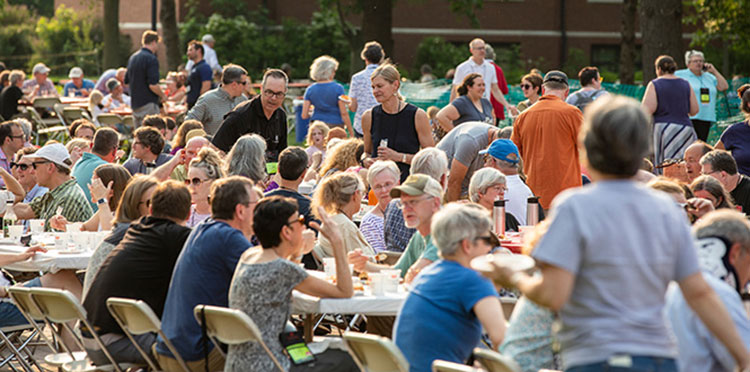 Alumni chat during All-Reunion Picnic.