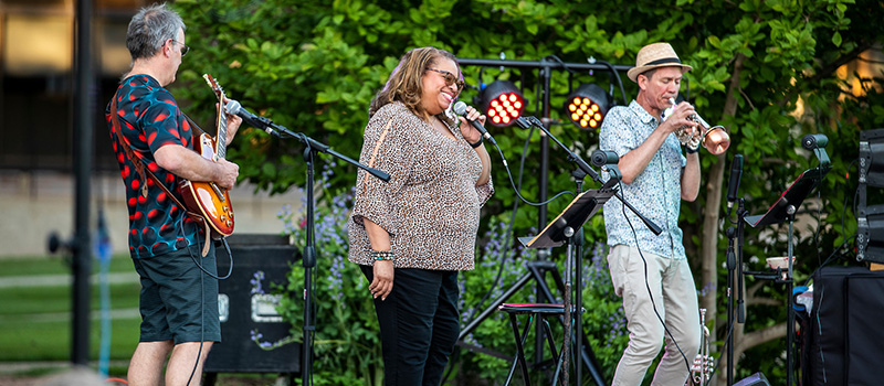 She Man and the Masters of the Universe perform on the Commencement stage on central campus.