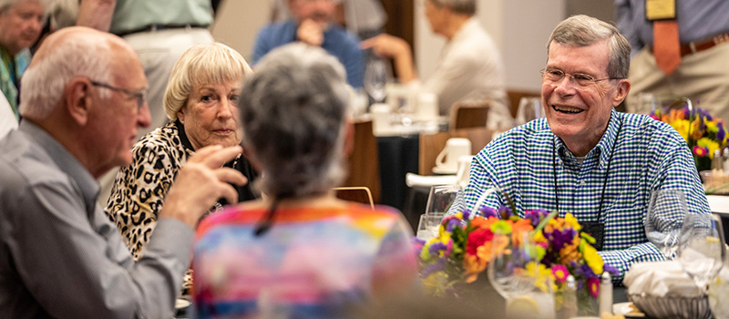 Bill McKnight '62 and Sue Fox McKnight '62 share a laugh with Hedda Haymond Smithson '62 and Tom Smithson.