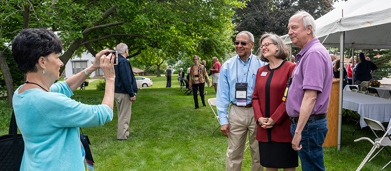 Trustee George Moose '66 and Tom Thomas '70 pose with President Anne F. Harris.
