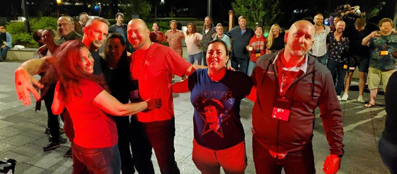 Alumni sway together arm in arm to end the night at the Reunion Dance Party.