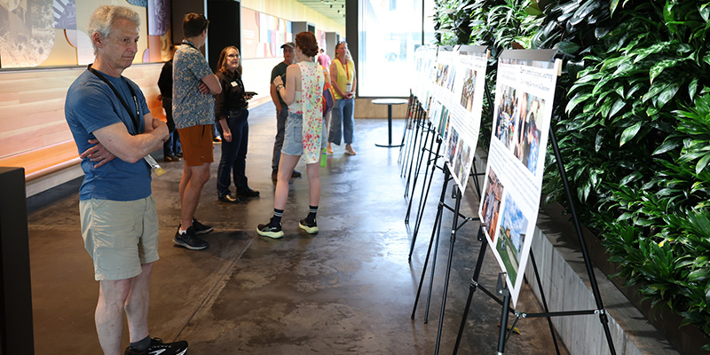 Reunion attendees read the displays at the Renfrow Hall residence hall.