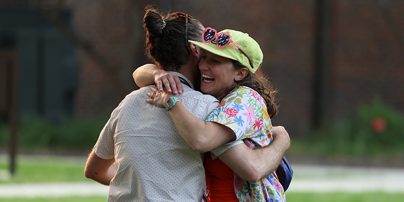 Amy Hadow '10 hugs a classmate.