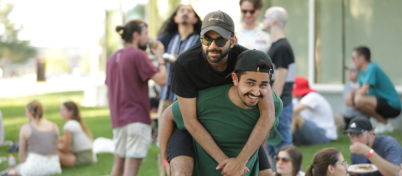 Anaan Ramay '20 gives Erhaan Ahmad '18 a piggy-back ride.