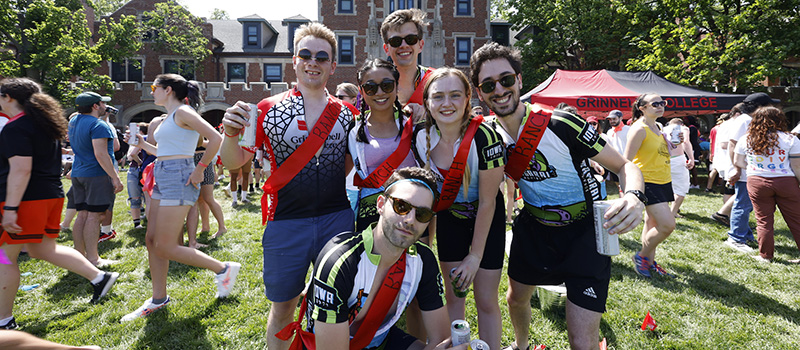 A relay team sporting RAGBRAI attire pose for a picture.