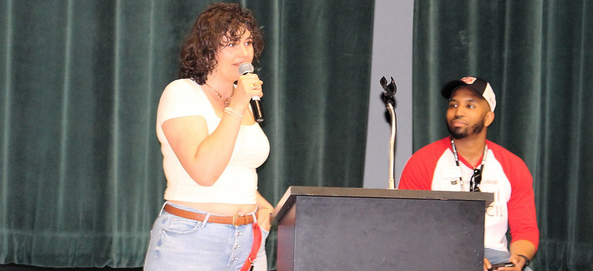 Iulia Iordache ’15, speaks during the 10th reunion brunch at Reunion 2015, with Alumni Council member Ben Vaughn Jr. ’15 looking on.
