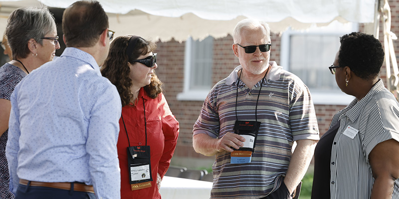 Ben Parker '82 and Cristy Lomenzo Parker chat with Beronda Montgomery, Joe Bagnoli, and Jill Petsel.