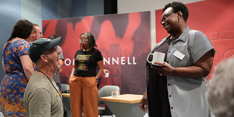 Beronda Montgomery, vice president of academic affairs and dean of the College, elicits a laugh from an alumnus.