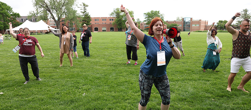 Alison (Williams) Presley ’03 uses a megaphone to lead activities on Mac Field.