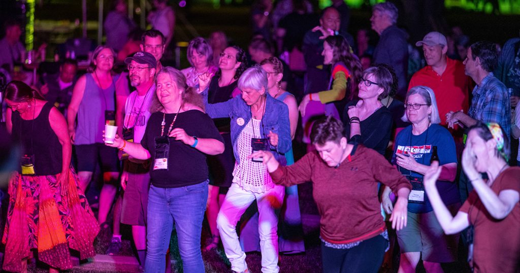 Grinnellians dance the night away at an outside concert on the commencement stage.