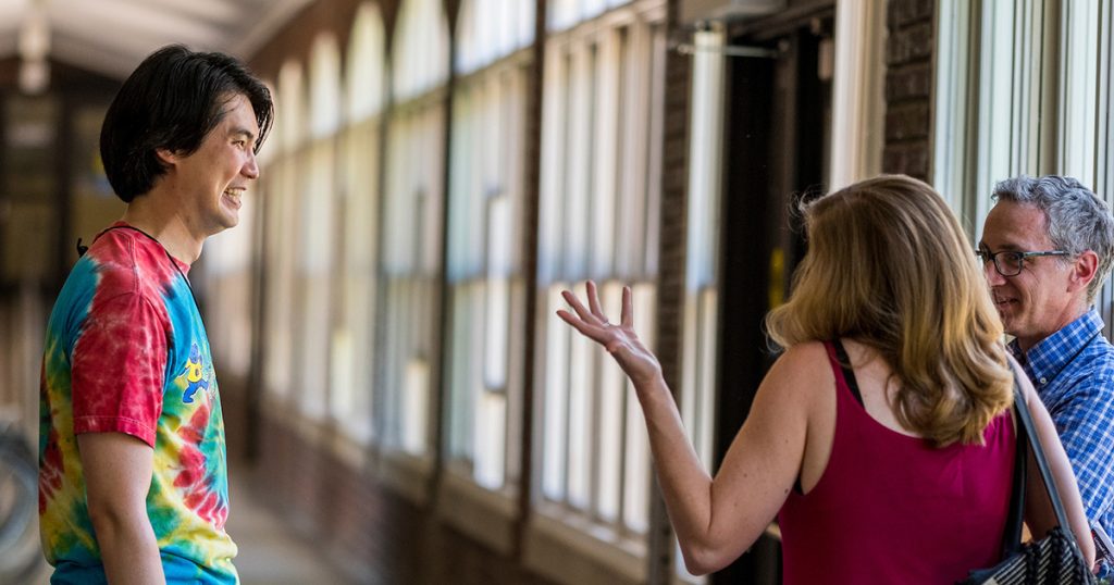 Grinnellians catch up in the loggia of the south campus dorms.