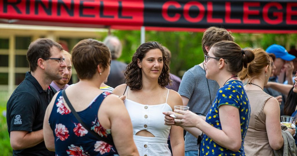 Friends catch up during the Saturday Social in the central campus lawn space.