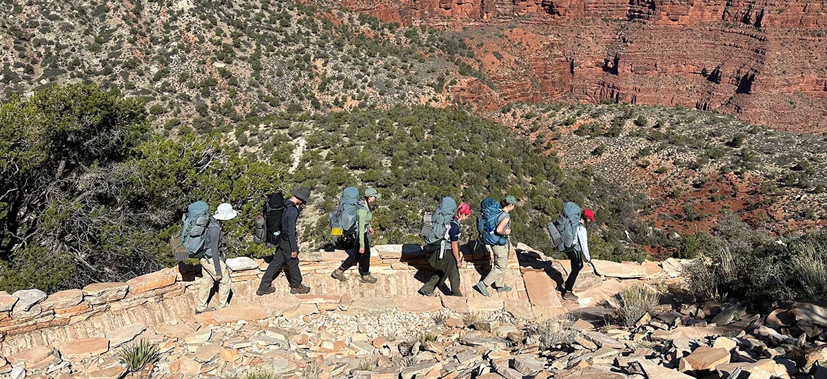 Students hike into the floor of the Grand Canyon while enjoying the scenery.