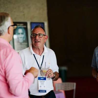 Alumni talking at event