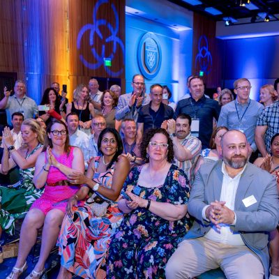 Attendees applauding during event