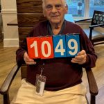 Martone holding scorecards - 1049